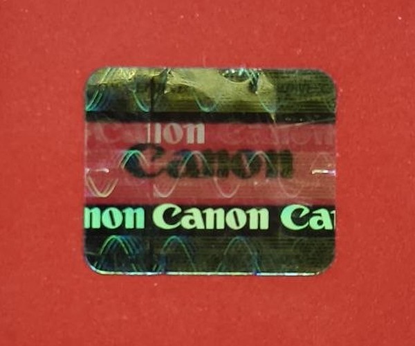 Голограмма Canon при прямом взгляде, золотисто-оливковый перелив